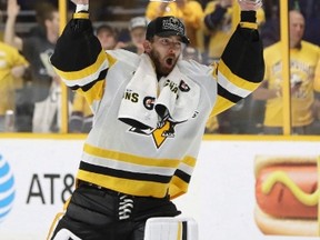 Pittsburgh Penguins' Matt Murray (30) celebrates with the Stanley Cup after defeating the Nashville Predators 2-0 in Game 6 of the NHL hockey Stanley Cup Final, Sunday, June 11, 2017, in Nashville, Tenn. (THE CANADIAN PRESS/ AP/Mark Humphrey)