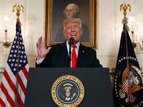 President Donald Trump speaks about the deadly white nationalist rally in Charlottesville, Va., Monday, Aug. 14, 2017, in the Diplomatic Room of the White House in Washington. (AP Photo/Evan Vucci)