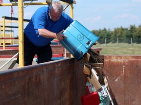 A man dumps some of his trash at the Salford landfill in Oxford County. (Sentinel-Review file photo)