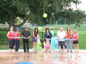 Central Huron Mayor Jim Ginn (third from left) was joined at the new splash pad by Community Improvement Co-oridinator Angela Smith, Clinton Raceway Marketing Manager Jessica Carnochan (centre), Central Huron Facilities Manager Steve Campbell and Clinton Community Pool lifeguards for the ribbon cutting.