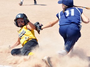 Kalea Keyser (left) of the Mitchell Squirt #2 girls team slides safely into third base during action against PDP (Plattsville-Drumbo-Princeton) in the championship game of the ‘A’ division in the Huron-Perth League playoff tournament Sunday, Aug. 13 in Stratford. ANDY BADER/MITCHELL ADVOCATE