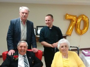 Sarnia residents Elie and Jeanne Bergeron celebrated 70 years of love and devotion by renewing their marriage. With the couple are shown with Mayor Mike Bradley, who brought greetings on behalf of the city, and with Father David Johnston of Sacred Heart Roman Catholic Church. (Handout/The Observer)