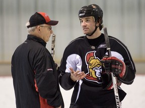 Coach Bryan Murray and veteran defenceman Luke Richardson share some thoughts on the ice at the end of practice on April 2, 2008 at the Sensplex as the Ottawa Senators prepare for their next game which is against Toronto on Thursday night. (Wayne Cuddington/Ottawa Citizen)