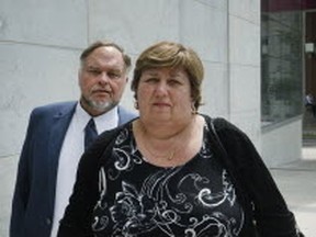 Dr. Rod Kunynetz and his wife, Valentina, leave a College of Physicians and Surgeons sentencing hearing for a lunch break on Monday. (STAN BEHAL, Toronto Sun)