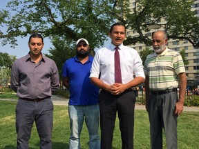 NDP leadership candidate Wab Kinew (third from left) announces proposed changes to the Provincial Nominee Program (PNP) in Winnipeg's Central Park at a press conference on Monday, Aug. 14, 2017, with support from (left to right) community activist Hani Al-Ubeady, and immigrants Muninder Sidhu and Mewa Bedi who have used the PNP