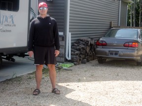 Local resident Matthew Connell stands on the former site of his home’s gravel pad, which he removed as part of a push by the Town of Whitecourt to enforce its Land Use Bylaw. The pad was to hold his RV, which he now parks on his driveway (Joseph Quigley | Whitecourt Star).