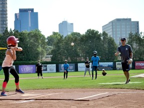 Twana Horamani swings at a pitch from London Majors shortstop Keith Kandel during a Rookie League Baseball game at Labatt Park. Organized by the London Police Service, the annual summer series provides London kids from London Middlesex Housing Corporation properties a chance to play baseball together. (CHRIS MONTANINI, Londoner)