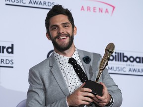Recording Artist Thomas Rhett, winner of the Top Country Song Award for 'Die a Happy Man' poses in the press room during the 2016 Billboard Music Awards at the T-Mobile Arena in Las Vegas, Nevada, on May 22, 2016. / AFP / BRYAN HARAWAY (Photo credit should read BRYAN HARAWAY/AFP/Getty Images)