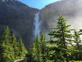 In this July 6, 2017 photo, water tumbles 1,246 feet (380 meters) at Takakkaw Falls in Yoho National Park in Canada's stretch of the Rocky Mountains, straddling the border of British Columbia and Alberta. It is an outdoorsman's paradise with scenic mountain hikes and crystal-blue water. (AP Photo/Adam Kealoha Causey)