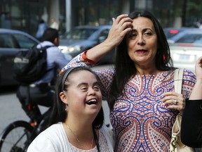 The Munoz family arrives at Toronto Police HQ for the first day of a tribunal against two officers and their comments towards daughter Francie, with mother parents Pamela on Tuesday August 15, 2017. (Michael Peake/Toronto Sun)