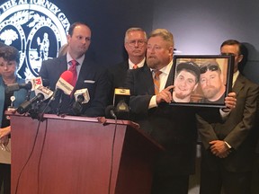 South Carolina Attorney General Alan Wilson, left, stands next to Rep. Eric Bedingfield, whose son died last year of a drug overdose, on Tuesday, Aug. 15, 2017, at his offices in Columbia, S.C. Wilson on Tuesday announced the state had sued Purdue Pharma, accusing the maker of OxyContin and other opioid drugs of violating South Carolina’s Unfair Trade Practices Act. (AP Photo/Meg Kinnard)