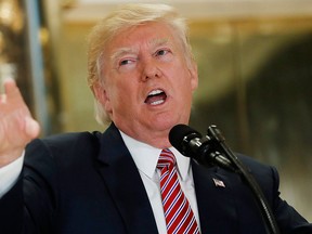 U.S. President Donald Trump speaks to the media in the lobby of Trump Tower in New York, Tuesday, Aug. 15, 2017. (AP Photo/Pablo Martinez Monsivais)