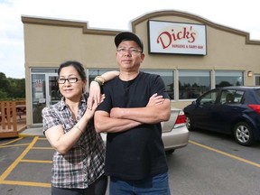 John and Kelly and Nguyen pose for a photo at their diner in Ottawa Ontario Wednesday Aug 15, 2017. Dick’s Drive-In and Dairy Dip has been open for 13 years and are closing on Sept. 12. TONY CALDWELL