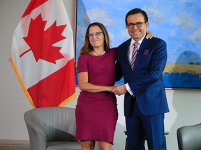 Foreign Minister Chrystia Freeland, left, greets Mexico Secretary of the Economy Ildefonso Guajardo Villarreal, at the Embassy of Canadian in Washington, Tuesday, Aug. 15, 2017. (AP Photo/Manuel Balce Ceneta)