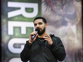 Drake makes an appearance during the Floyd Mayweather and Conor McGregor promotional tour stop in Toronto on Wednesday, July 12, 2017, for their upcoming boxing match in Las Vegas. (THE CANADIAN PRESS/Christopher Katsarov)