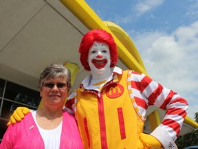Sandra Cox with Ronald McDonald at the 530 Oxford St. West McDonalds, where she worked for the company for 30 years. (CHARLIE PINKERTON/THE LONDON FREE PRESS/POSTMEDIA NETWORK)