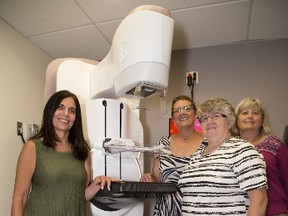 Dr. Anat Kornecki, left, of St. Joseph?s Health Care?s breast care program, and patients Jane Terhaerdt, Betty Powell and Susan Forde flank the hospital?s new Senographe Pristina mammography machine in London Tuesday. (DEREK RUTTAN/THE LONDON FREE PRESS)