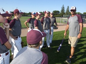 Mike Lumley the longtime coach and head of the Badgers minor baseball program, talks to his midgets before practice Tuesday August 15, 2017 at the Stronach fields. The London Badgers will be the host club for the national midget championships. (MIKE HENSEN, The London Free Press)