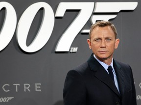 In this Oct. 28, 2015, file photo, actor Daniel Craig poses for the media as he arrives for the German premiere of the James Bond movie 'Spectre' in Berlin, Germany. Craig announced on "The Late Show with Stephen Colbert” Aug. 15, 2017, that he would return as the British super spy in 2019's "Bond 25." (AP Photo/Michael Sohn, File)