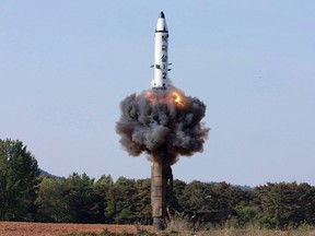 In this undated file photo distributed by the North Korean government on May 22, 2017, a solid-fuel "Pukguksong-2" missile lifts off during its launch test at an undisclosed location in North Korea. (Korean Central News Agency/Korea News Service via AP/Files)