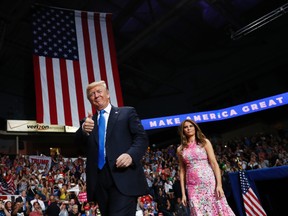 U.S. President Donald Trump and first lady Melania Trump arrive for a rally at the Covelli Centre in Youngstown, Ohio, on Tuesday, July 25, 2017. (Carolyn Kaster/AP Photo)