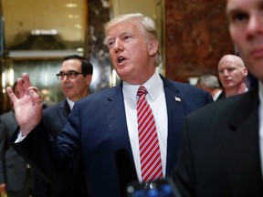 President Donald Trump gestures as he answers reporters questions in the lobby of Trump Tower, Tuesday, Aug. 15, 2017 in New York. (AP Photo/Pablo Martinez Monsivais)
