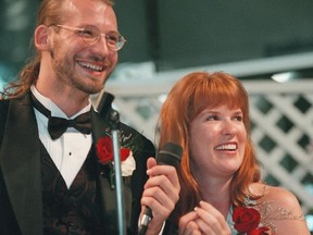 In this June 13, 1998 file photo, David Weinlick and Elizabeth Runze speak to the audience after Runze was picked to be Weinlick's bride at Mall of America in Bloomington, Minn. The Minnesota couple who began their life together through an arranged marriage nearly 20 years ago are about to renew their vows. The ceremony on Friday, Aug. 18, 2017 will again be at the Mall of America. (Scott Cohen/AP Photo/Files)