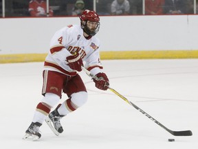 In this March 25, 2017, file photo, University of Denver's Will Butcher skates up the ice during the first period in the regional semifinals of the NCAA college hockey tournament against Michigan Tech, in Cincinnati. (AP Photo/John Minchillo, File)