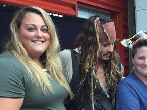 Actor Johnny Depp, in character as Capt. Jack Sparrow of the Pirates of the Caribbean movies, visits the BC Children’s Hospital on Monday to help lift the spirits of the children there, including Harlow Montroy, 3, being held by her mother, Amanda, a longtime Kingston resident who now lives in Chilliwack, B.C. To the left of Depp is Jenna Montroy, Harlow’s other mother. (Submitted Photo)