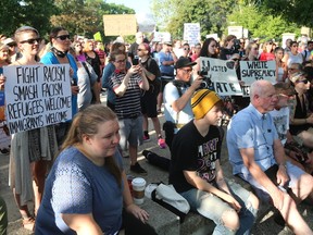 Hundreds gathered at the entrance of London?s Victoria Park Wednesday for a peaceful protest against racism. (MIKE HENSEN, The London Free Press)