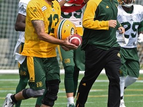 Edmonton Eskimos quarterback Mike Reilly jogging with head coach Jason Maas during practice at Clarke Stadium in Edmonton, August 14, 2017.