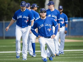 Toronto Blue Jays pitcher J.P. Howell, front, warms up during baseball spring training in Dunedin, Fla., on Feb. 15, 2017. (NATHAN DENETTE/The Canadian Press files)
