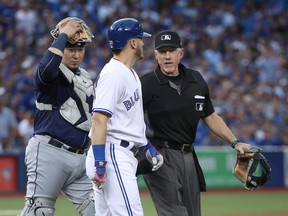 Josh Donaldson of the Toronto Blue Jays reacts after being hit by a pitch against the Tampa Bay Rays during MLB action at Rogers Centre on Aug. 16, 2017. (Tom Szczerbowski/Getty Images)
