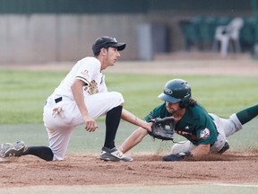 Edmonton's Zane Takhar (6) can't tag Swift Current's Riley Campbell (8) out during Game 4 of the WMBL final playoff series between the Edmonton Prospects and the Swift Current 57s at Re/Max Field in Edmonton on Wednesday, Aug. 16, 2017.