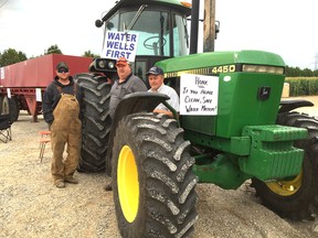 Members of the group Water Wells First are blocking the entrances to three wind turbine construction sites in the former Chatham Township Thursday morning. Among the blockade participants, at a work site on Country View Line west of Dresden and north of Chatham, are Brian Leclair (left), Dave Cameron and Scott Moir. (PETER EPP, Chatham Daily News)