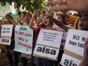 Indian students shout slogans during a protest against the latest incidents of rape in New Delhi, India, on Oct. 18, 2015. (Tsering Topgyal/AP Photo/Files)