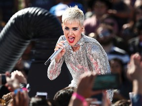 In this Monday, June 12, 2017, file photo, Katy Perry performs during 'Katy Perry - Witness World Wide' exclusive YouTube Livestream Concert at Ramon C. Cortines School of Visual and Performing Arts in Los Angeles. The pop star’s “Witness: The Tour” is pushing back the start of her new tour to Sept. 19 in Montreal. Perry said in a statement Thursday, Aug. 17, that “major elements of my tour stage design could not be available for me to rehearse on until this week.” (Photo by John Salangsang/Invision/AP, File)