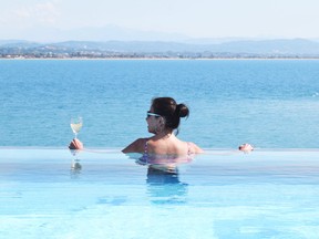 The infinity pool at the back of the new Viking Sky cruise ship became a favourite hangout of travel writer Steve MacNaull and his wife, Kerry, pictured. (STEVE MACNAULL PHOTO)