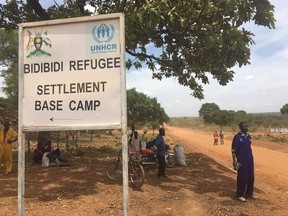 Matthew Fisher/Postmedia Network
A sign announces the Bidibidi refugee camp in Uganda. Last summe,r Bidibidi did not exist. It is now home to the world’s largest refugee camp, with 272,000 South Sudanese living within a sprawling, dusty landscape about 40 kilometres south of the South Sudan border