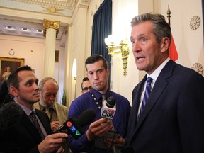 Premier Brian Pallister answers questions from the media about his cabinet shuffle on Thursday, Aug. 17, 2017 in Winnipeg. JOYANNE PURSAGA/Winnipeg Sun/Postmedia Network