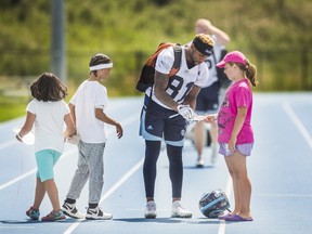 Kendall Sanders signs autographs for some young fans after an Toronto Argonauts practice at Downsview Park in Toronto on Aug. 9, 2017. (Ernest Doroszuk/Toronto Sun/Postmedia Network)
