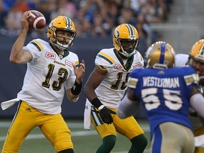 Edmonton Eskimos quarterback Mike Reilly pulls back a pass attempt during CFL action against the Winnipeg Blue Bombers in Winnipeg on Thurs., Aug. 17, 2017.