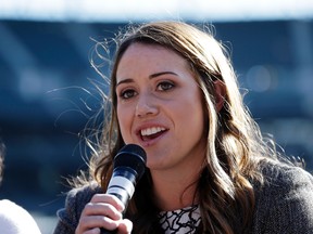 In this Tuesday, Aug. 15, 2017, photo, Amanda Hopkins talks on a panel on women in baseball before a baseball game between the Seattle Mariners and the Baltimore Orioles in Seattle. Hopkins, 24, is about to complete her second year as an area scout for the Mariners, a position that has made her a part of baseball history. She is the first full-time female baseball scout in more than a half-century, breaking through a barrier that required diligence on her end and willingness by the Mariners organization. (AP Photo/Elaine Thompson)