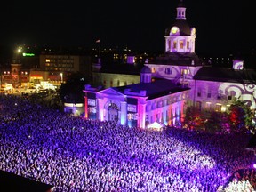Thousands of people fill Market Square for the live-streaming of The Tragically Hip concert at the Rogers K-Rock Centre on Aug. 20, 2016. (Steph Crosier/The Whig-Standard)