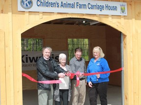 In this file photo, Sarnia Mayor Mike Bradley, the Alix Foundation's Judy and Adam Alix and Seaway Kiwanis president Donna Kelso cut the ribbon at the new carriage house completed recently at Canatara Park. The Judith and Norman Alix Foundation is currently accepting a new round of grant applications. The deadline to apply is Oct. 1. (File photo)