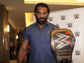 World Wrestling Entertainment champion Jinder Mahal of Calgary poses with his title belt during international media interviews in downtown Brooklyn, N.Y., on Friday. Mahal faces Japanese sensation Shinsuke Nakamura for the title at SummerSlam on Sunday. (George Tahinos/SLAM! Wrestling)