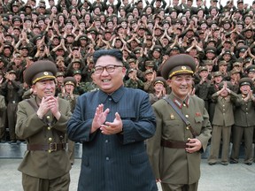 North Korean leader Kim Jong-un acknowledges a welcome from military officers during his visit to Korean People?s Army?s Strategic Forces in North Korea.  (Korean Central News Agency via AP)