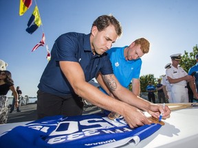 Toronto Maple Leafs Josh Leivo, left, and Connor Brown sign autographs aboard the Canadian Armed Forces HMCS Toronto frigate, docked for it's final night as a part of Canada 150th celebrations at Sugar Beach in downtown Toronto on July 4, 2017. (Ernest Doroszuk/Toronto Sun/Postmedia Network)