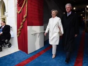 Former US President Bill Clinton and First Lady Hillary Clinton arrive for the Presidential Inauguration of Donald Trump at the US Capitol in Washington, DC, January 20, 2017. (SAUL LOEB/Getty Images)