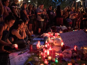 People gather around tributes laid on Las Ramblas near the scene of yesterday's terrorist attack, on August 18, 2017 in Barcelona, Spain. (Photo by Carl Court/Getty Images)